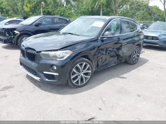 Photo 1 VIN: WBXHU7C30J3F04236 - BMW X1 