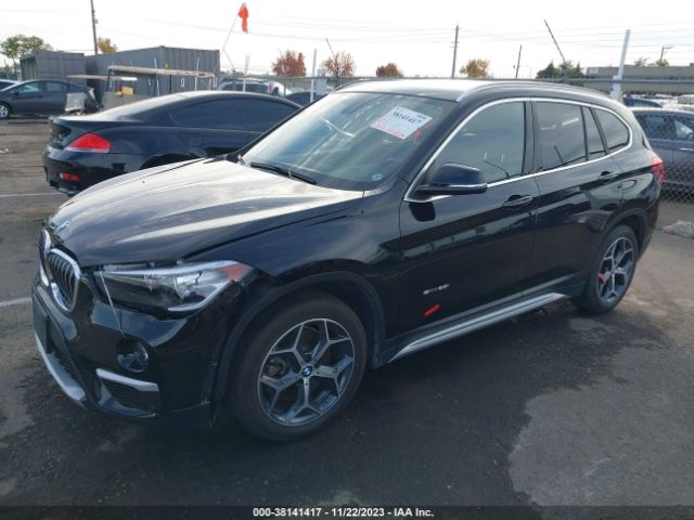 Photo 1 VIN: WBXHU7C30J5H43466 - BMW X1 