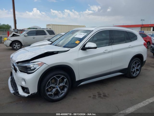 Photo 1 VIN: WBXHU7C30J5L06094 - BMW X1 