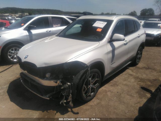 Photo 1 VIN: WBXHU7C31H5H34575 - BMW X1 