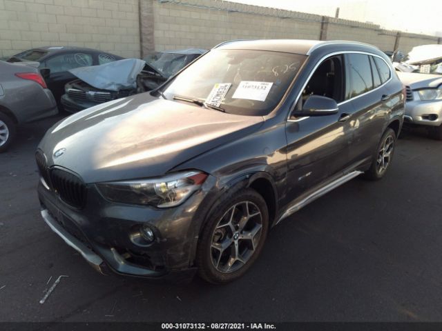 Photo 1 VIN: WBXHU7C31J5H40186 - BMW X1 