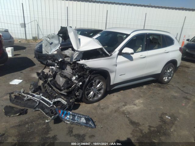 Photo 1 VIN: WBXHU7C32H5H37002 - BMW X1 