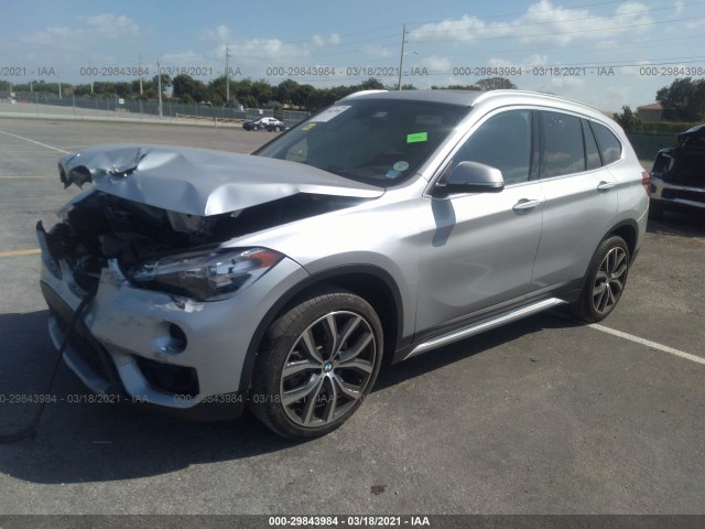 Photo 1 VIN: WBXHU7C32J3H42492 - BMW X1 