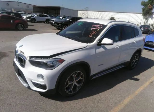 Photo 1 VIN: WBXHU7C32J5H41024 - BMW X1 