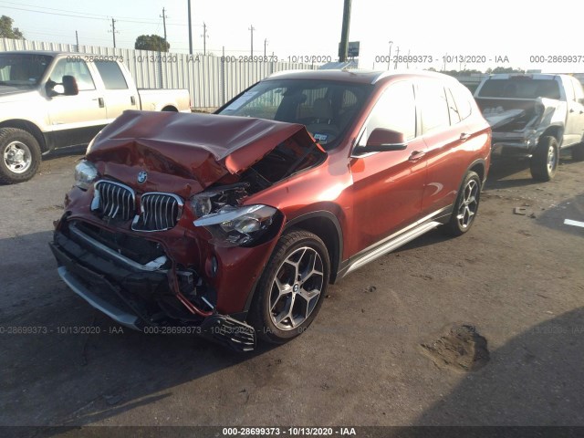 Photo 1 VIN: WBXHU7C32J5L08977 - BMW X1 