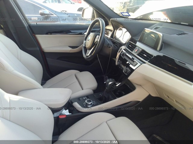 Photo 4 VIN: WBXHU7C32J5L08977 - BMW X1 