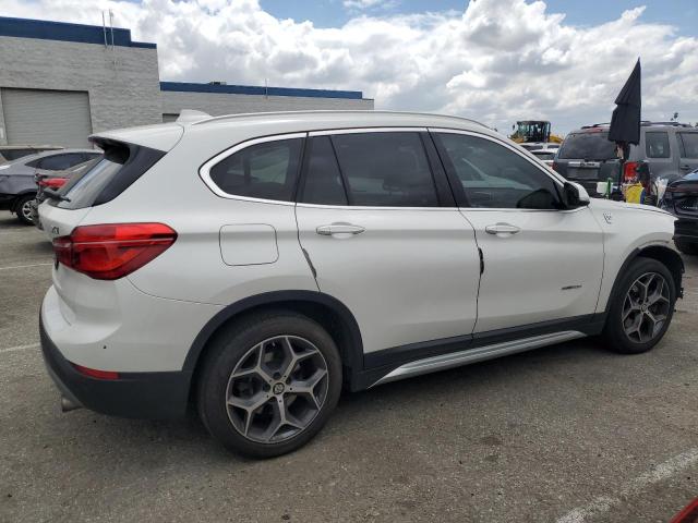 Photo 2 VIN: WBXHU7C33H5H34402 - BMW X1 