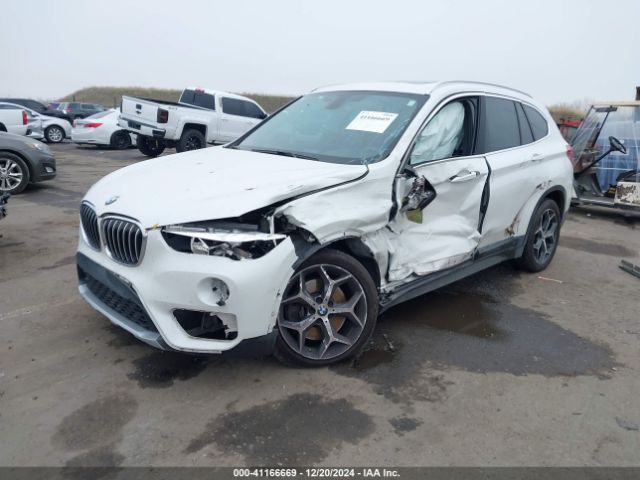 Photo 1 VIN: WBXHU7C33J5H41419 - BMW X1 