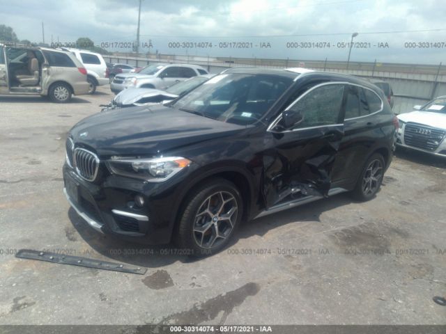 Photo 1 VIN: WBXHU7C33J5L05599 - BMW X1 