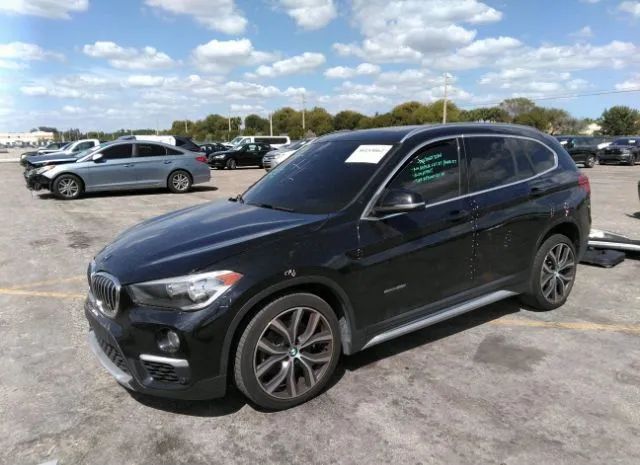 Photo 1 VIN: WBXHU7C34H5H34005 - BMW X1 