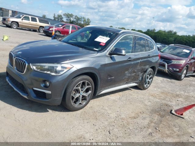 Photo 1 VIN: WBXHU7C34H5H35283 - BMW X1 