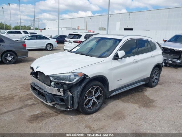 Photo 1 VIN: WBXHU7C34H5H37454 - BMW X1 