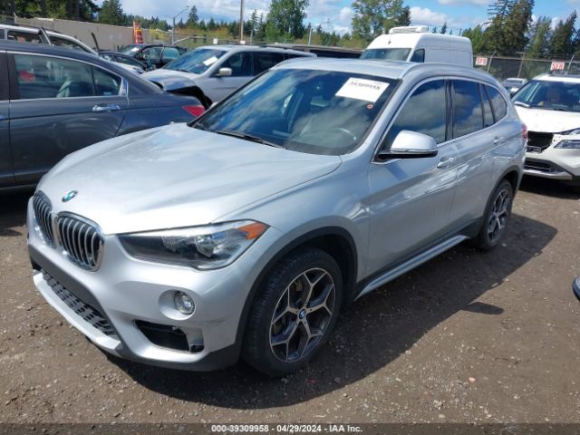 Photo 1 VIN: WBXHU7C34J3H43224 - BMW X1 