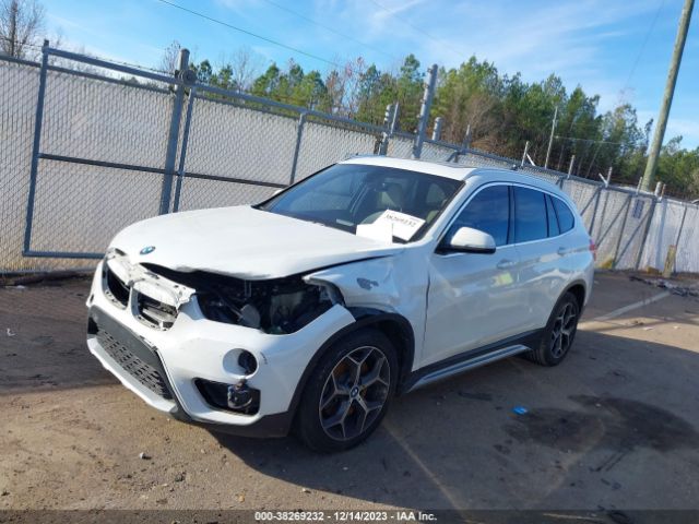 Photo 1 VIN: WBXHU7C34J3H43823 - BMW X1 