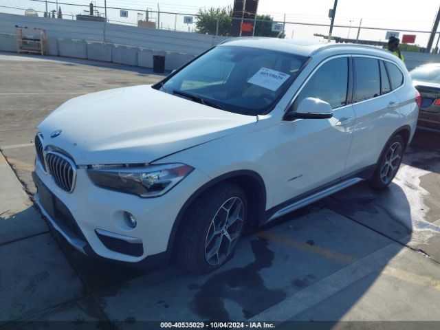 Photo 1 VIN: WBXHU7C34J5H41378 - BMW X1 