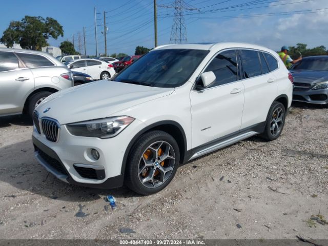 Photo 1 VIN: WBXHU7C34J5L05109 - BMW X1 