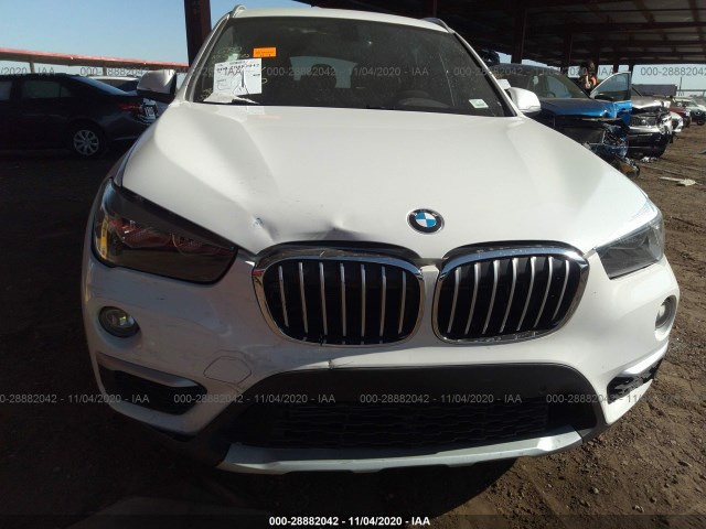 Photo 5 VIN: WBXHU7C35H5H32540 - BMW X1 