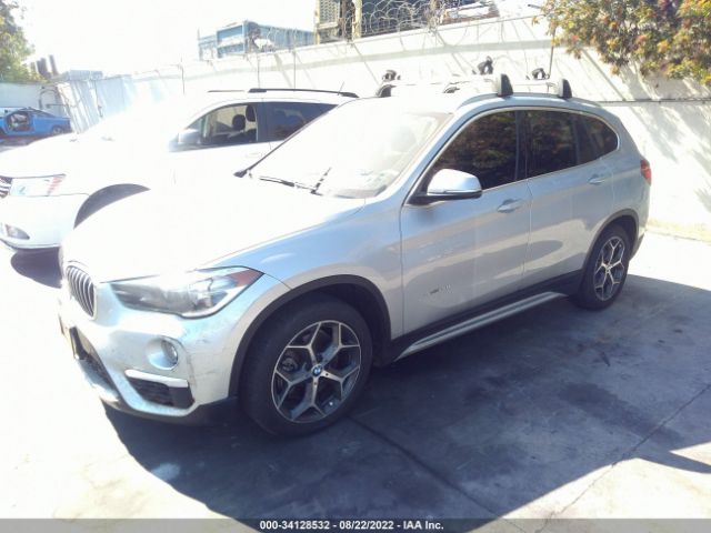 Photo 1 VIN: WBXHU7C35J5H39297 - BMW X1 