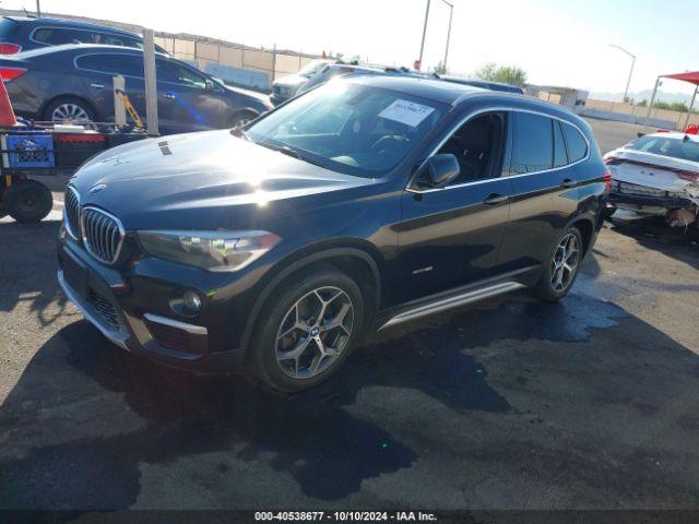 Photo 1 VIN: WBXHU7C35J5H40661 - BMW X1 