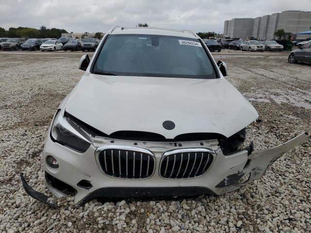 Photo 4 VIN: WBXHU7C36J5H39499 - BMW X1 