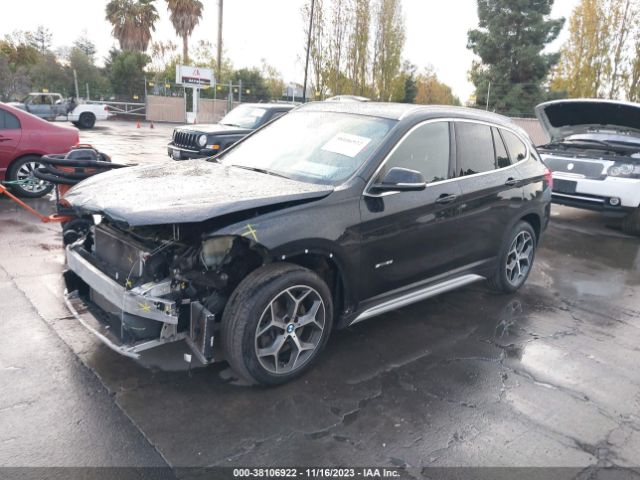 Photo 1 VIN: WBXHU7C36J5H40104 - BMW X1 