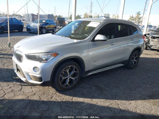 Photo 1 VIN: WBXHU7C36J5H41429 - BMW X1 