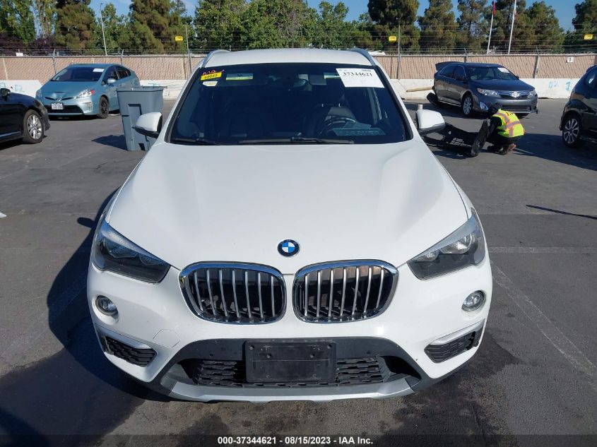 Photo 11 VIN: WBXHU7C37H5H33317 - BMW X1 