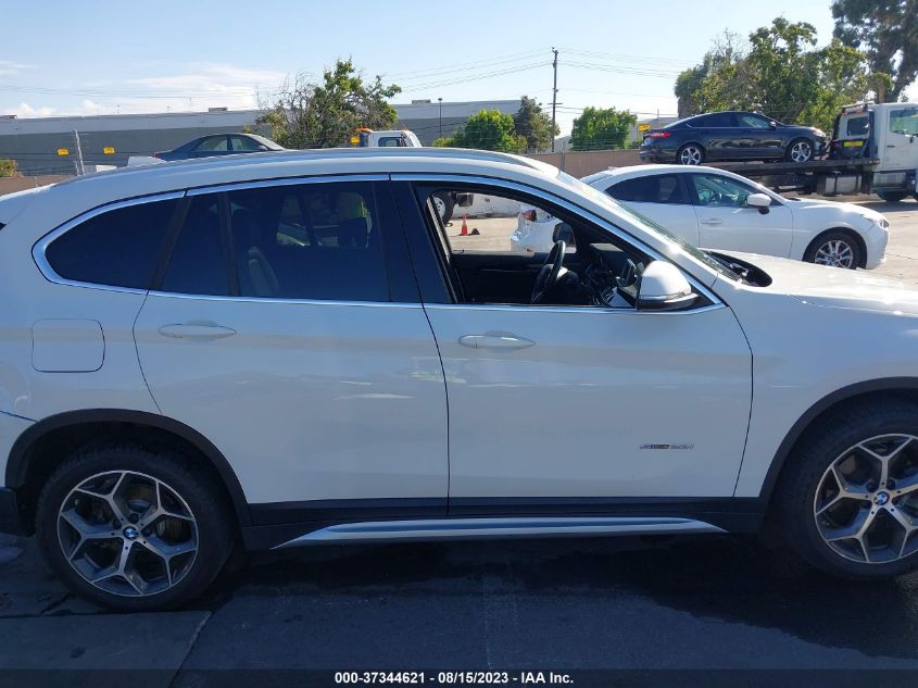 Photo 12 VIN: WBXHU7C37H5H33317 - BMW X1 