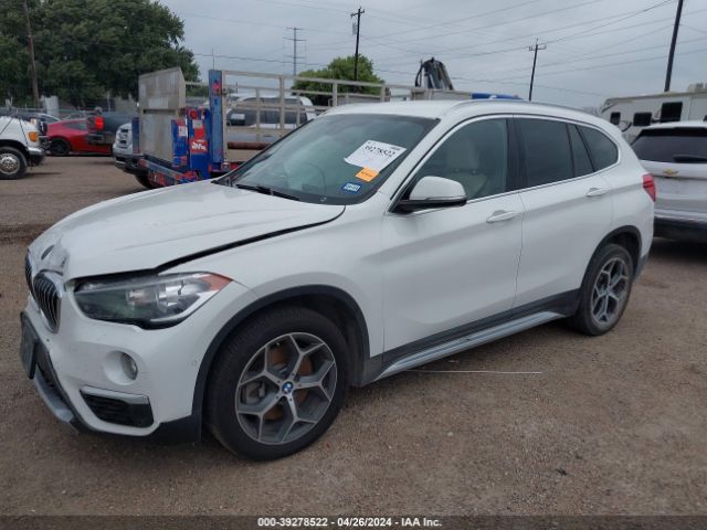 Photo 1 VIN: WBXHU7C37J3H43105 - BMW X1 