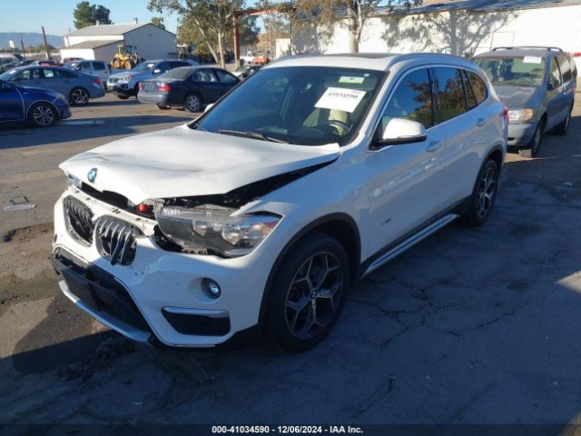 Photo 1 VIN: WBXHU7C37J5H40404 - BMW X1 