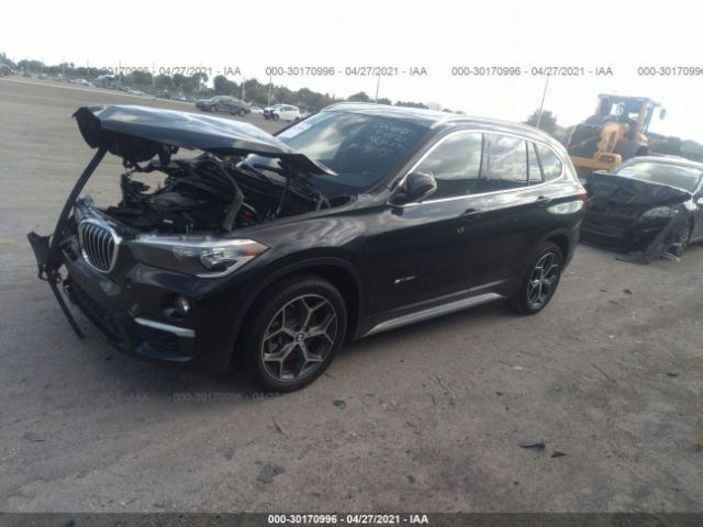 Photo 1 VIN: WBXHU7C37J5H42895 - BMW X1 