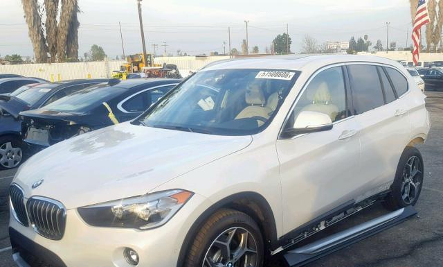 Photo 1 VIN: WBXHU7C38J3H43243 - BMW X1 