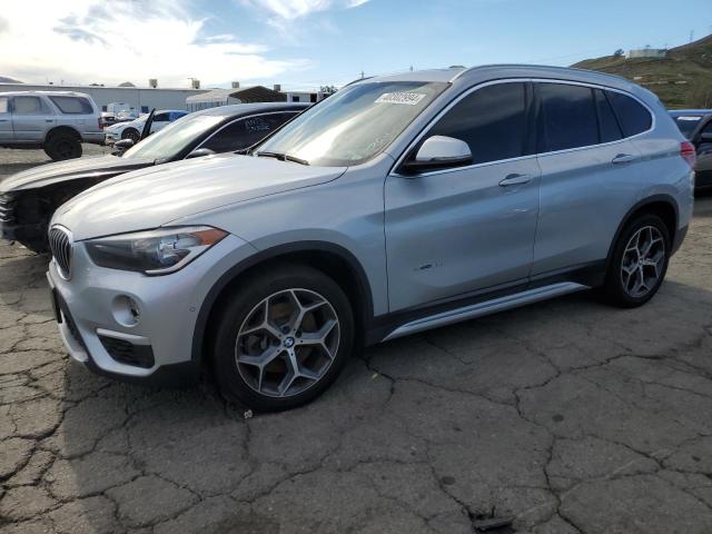 Photo 0 VIN: WBXHU7C38J5H38872 - BMW X1 