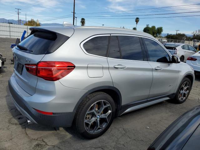 Photo 2 VIN: WBXHU7C38J5H38872 - BMW X1 