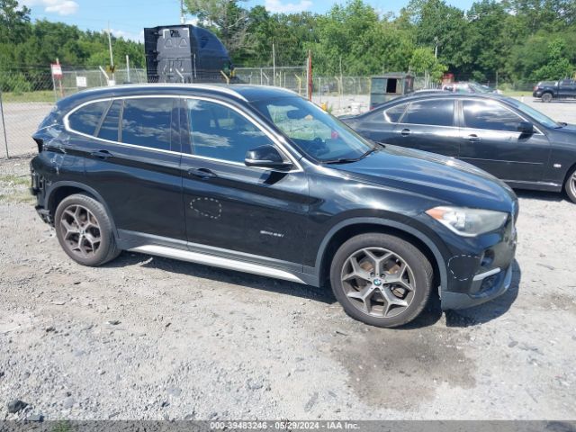 Photo 0 VIN: WBXHU7C38J5H40380 - BMW X1 