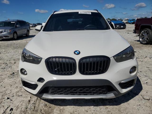 Photo 4 VIN: WBXHU7C39H5H37918 - BMW X1 