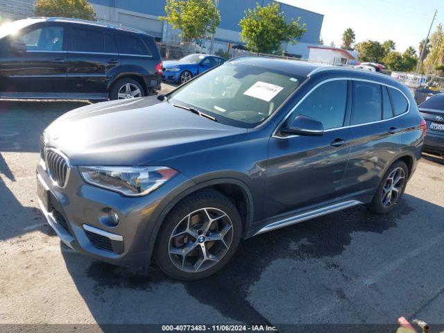 Photo 1 VIN: WBXHU7C39J3F04543 - BMW X1 