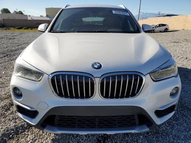 Photo 4 VIN: WBXHU7C3XH5H38625 - BMW X1 