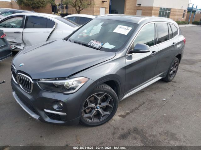 Photo 1 VIN: WBXHU7C51K3H46083 - BMW X1 