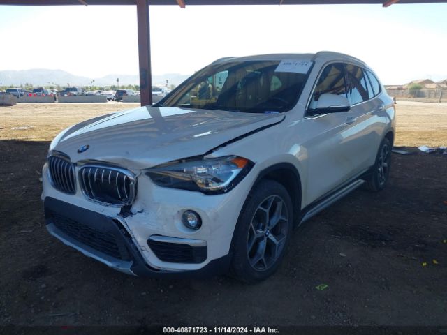 Photo 1 VIN: WBXHU7C51K5N37606 - BMW X1 