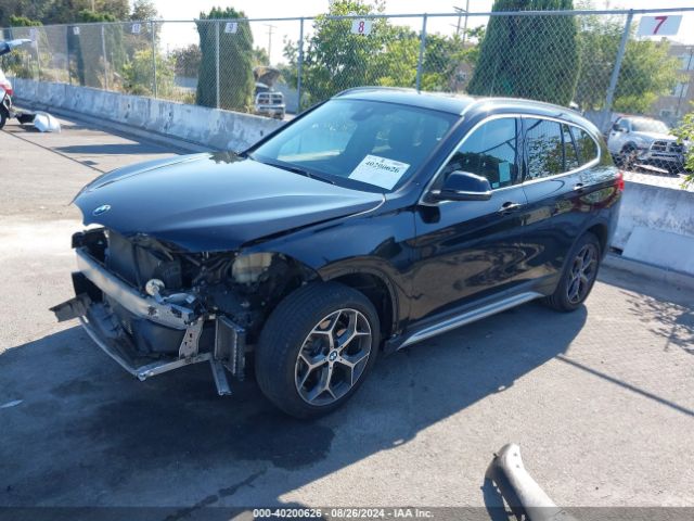 Photo 1 VIN: WBXHU7C52K3H44472 - BMW X1 