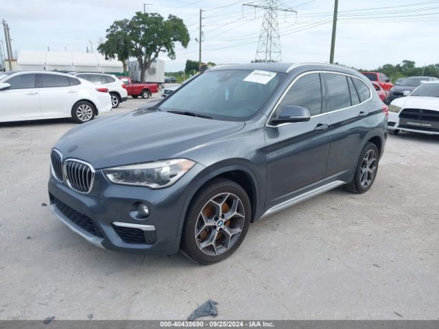 Photo 1 VIN: WBXHU7C54K3H45509 - BMW X1 