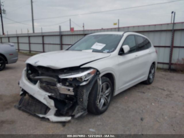 Photo 1 VIN: WBXHU7C54K5L10409 - BMW X1 