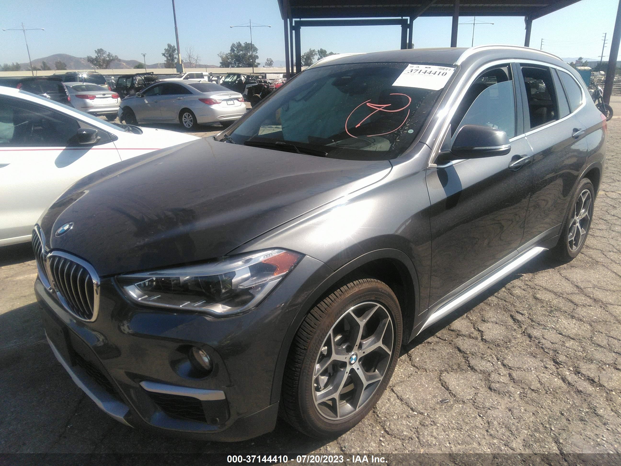 Photo 1 VIN: WBXHU7C54K5L11799 - BMW X1 