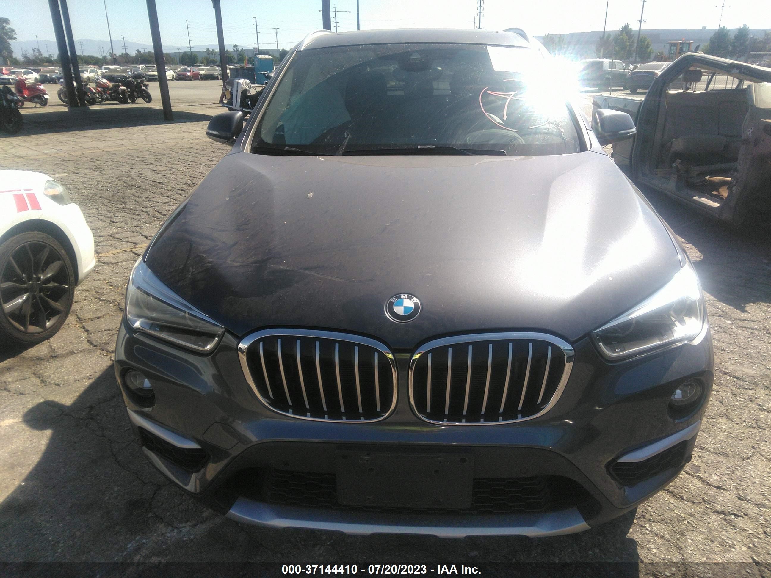 Photo 11 VIN: WBXHU7C54K5L11799 - BMW X1 