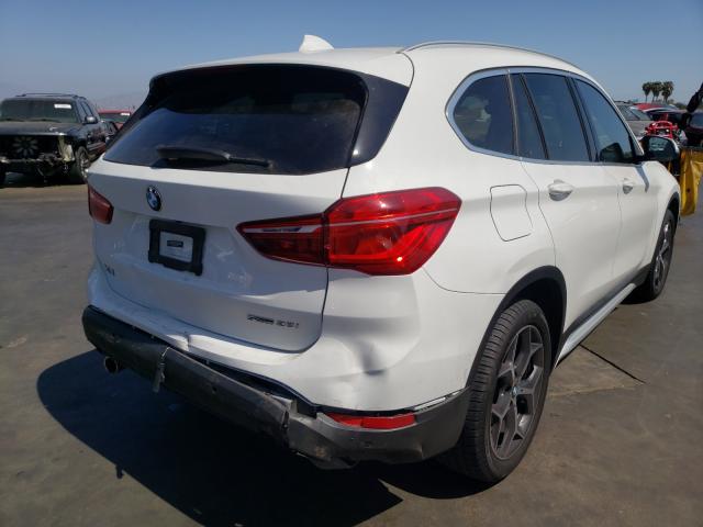 Photo 3 VIN: WBXHU7C55K5L10287 - BMW X1 