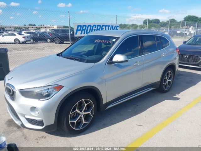 Photo 1 VIN: WBXHU7C57K5L11036 - BMW X1 