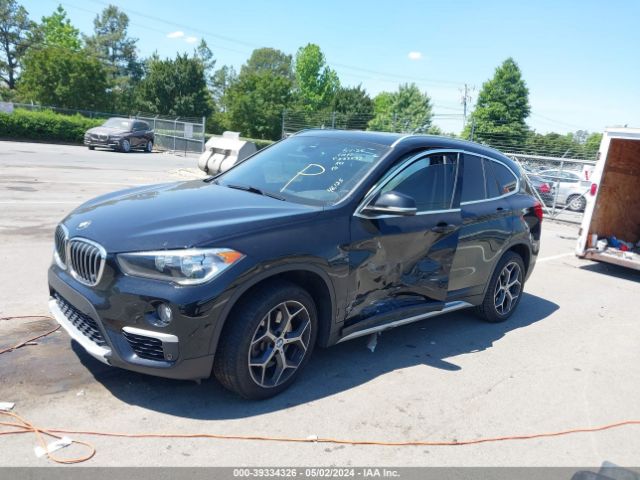 Photo 1 VIN: WBXHU7C58K5N53432 - BMW X1 