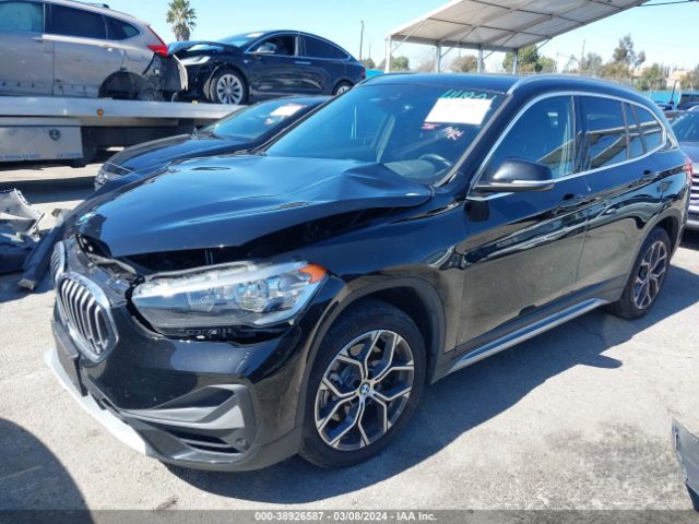 Photo 1 VIN: WBXJG7C04M5T57987 - BMW X1 